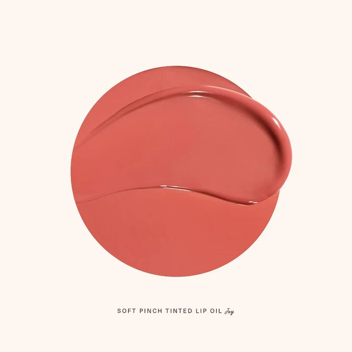 Rare Beauty Soft Pinch Tinted Lip Oil Stain in various shades, displayed on a beauty product image.