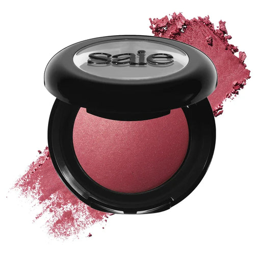 Saie Dew SuperSuede™ talc-free powder blush in various shades, featuring a close-up of the compact with natural light reflecting on the surface.