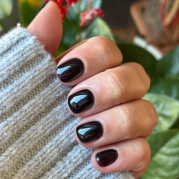 SD - Gel on short natural nails with a glossy deep plum polish for a sleek, long-lasting manicure by Olive and June