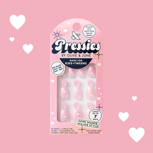 Shiny Pink Has My Heart - Pressies | Extra Short Short | Round showing pink heart-patterned press on false nails in packaging