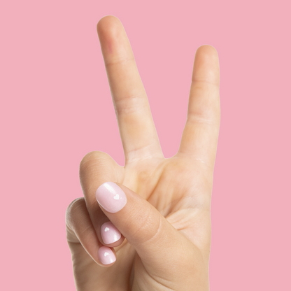 Shiny Pink Has My Heart - Pressies | Extra Short Short | Round showing hand with pink heart detail press on mani on pink background