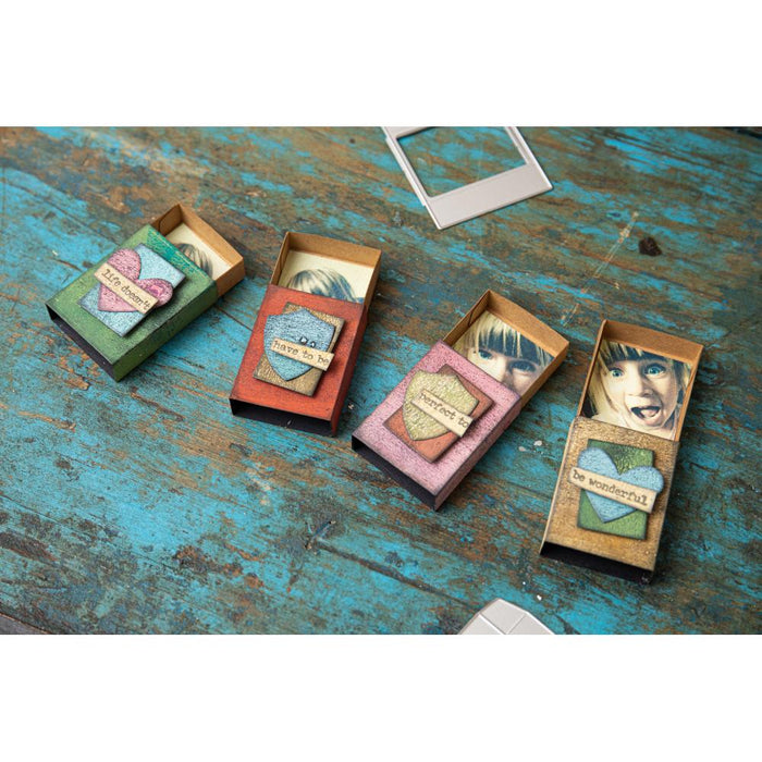 Sizzix - Thinlits Dies By Tim Holtz - 10/Pkg - Vault Matchbox. These dies are compatible with leading die cutting machines (sold separately). These dies are designed to cut through paper, cardstock, and other thin materials. Available at Embellish Away located in Bowmanville Ontario Canada. Example by Tim Holtz