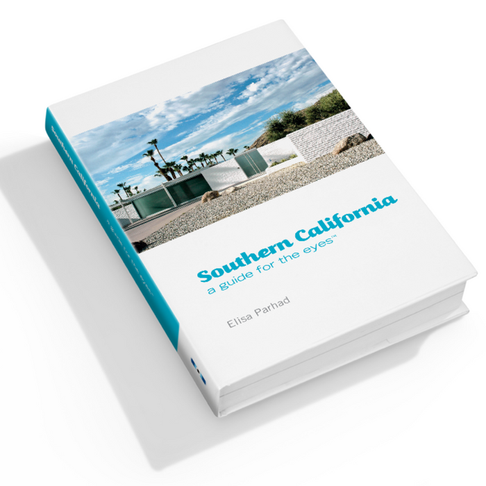 Hardcover guide book with beach photo cover and turquoise title lettering