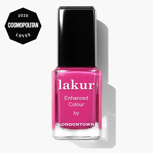 A bottle of LONDONTOWN Summer Fling Lakur Enhanced Colour nail polish in shocking pink, featuring a "2025 Cosmopolitan Loves" badge. This cruelty-free polish delivers bold color with a conscience.