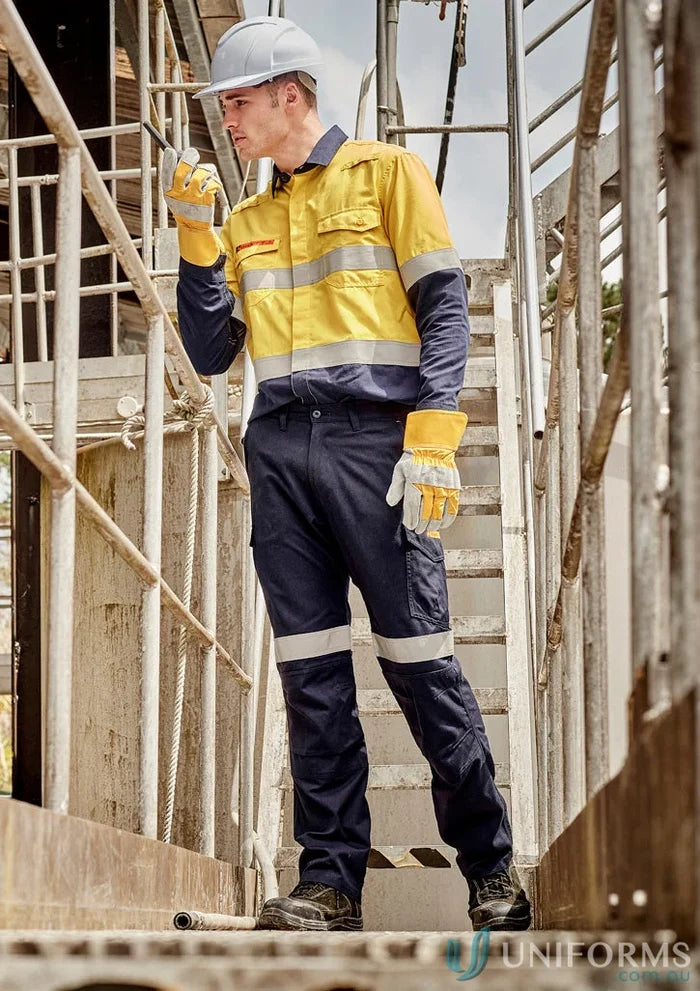 Construction worker in safety gear wearing Syzmic Range Mens Orange Flame Taped Cargo Pant ZP521