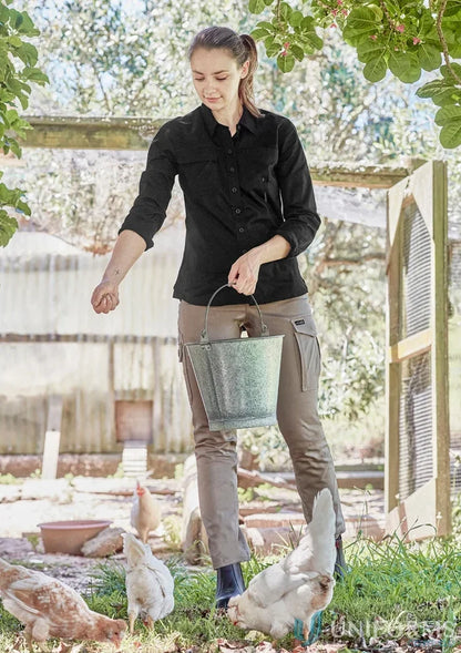 Green metal bucket with handle shown alongside 1Komma5 womens lightweight tradie shirt ideal for work uniforms and workwear