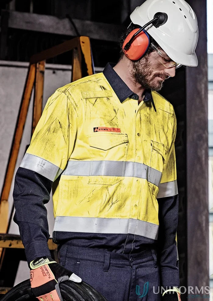 Man in safety gear wearing Syzmik Orange Flame HRC 2 Hoop Taped Spliced Shirt