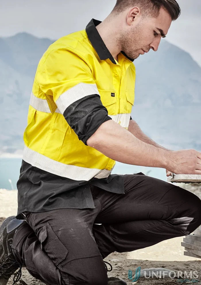 Man in Syzmik Rugged Cooling Vis Taped Long Sleeve Shirt for high visibility workouts