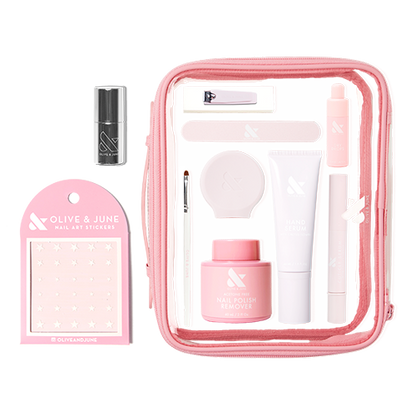 The Mani Weekender - 6 Polishes kit with nail care tools, nail polish remover, hand serum, and nail art stickers in a pink bag