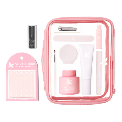 The Mani Weekender - 6 Polishes kit with nail care tools, polish remover, hand serum, and nail art stickers in a pink bag
