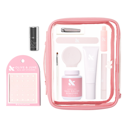 The Mani Weekender - 6 Polishes kit featuring nail care essentials, remover, hand serum, nail art stickers, and tools in a pink pouch