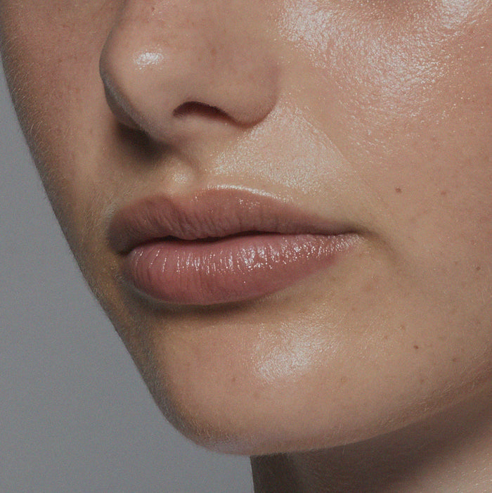 Tint Me Lip Punch lip balm, mauve glossy lips close-up