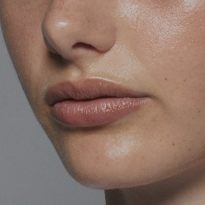 Tint Me Lip Punch lip balm, mauve glossy lips close-up