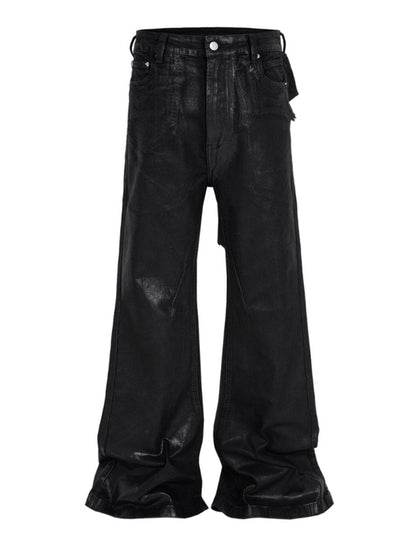 Heavyweight black denim jeans with wide flare legs and patchwork rear detailing