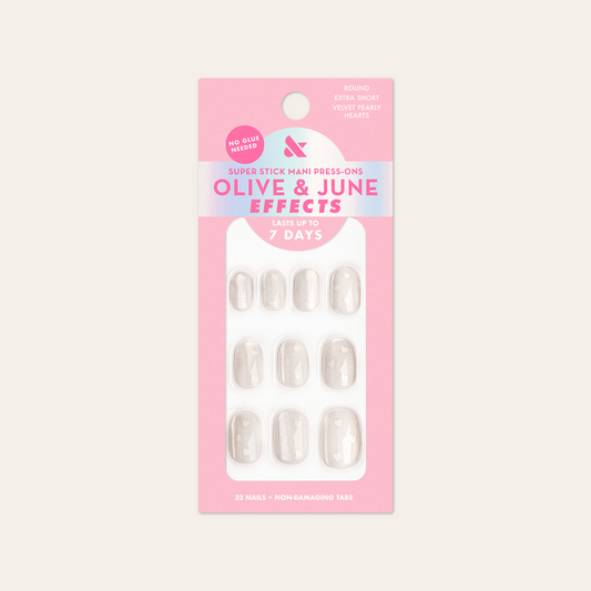 Velvet Pearly Hearts - Tab Press On | Extra Short | Round false nails with white heart accents on pearly velvet base in retail packaging