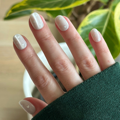 Velvet Pearly Hearts - Tab Press On | Extra Short | Round press-on nails with soft white velvet and tiny heart details on hand