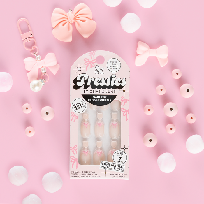 Wrapped in Pink - Pressies | Short Medium | Round showing baby pink french press on nails with 3D bow detail in packaging